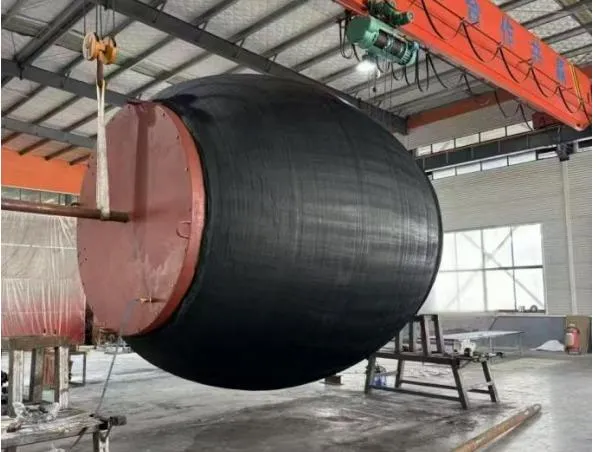 Multi-size high pressure pipe plug lifted in a workshop.